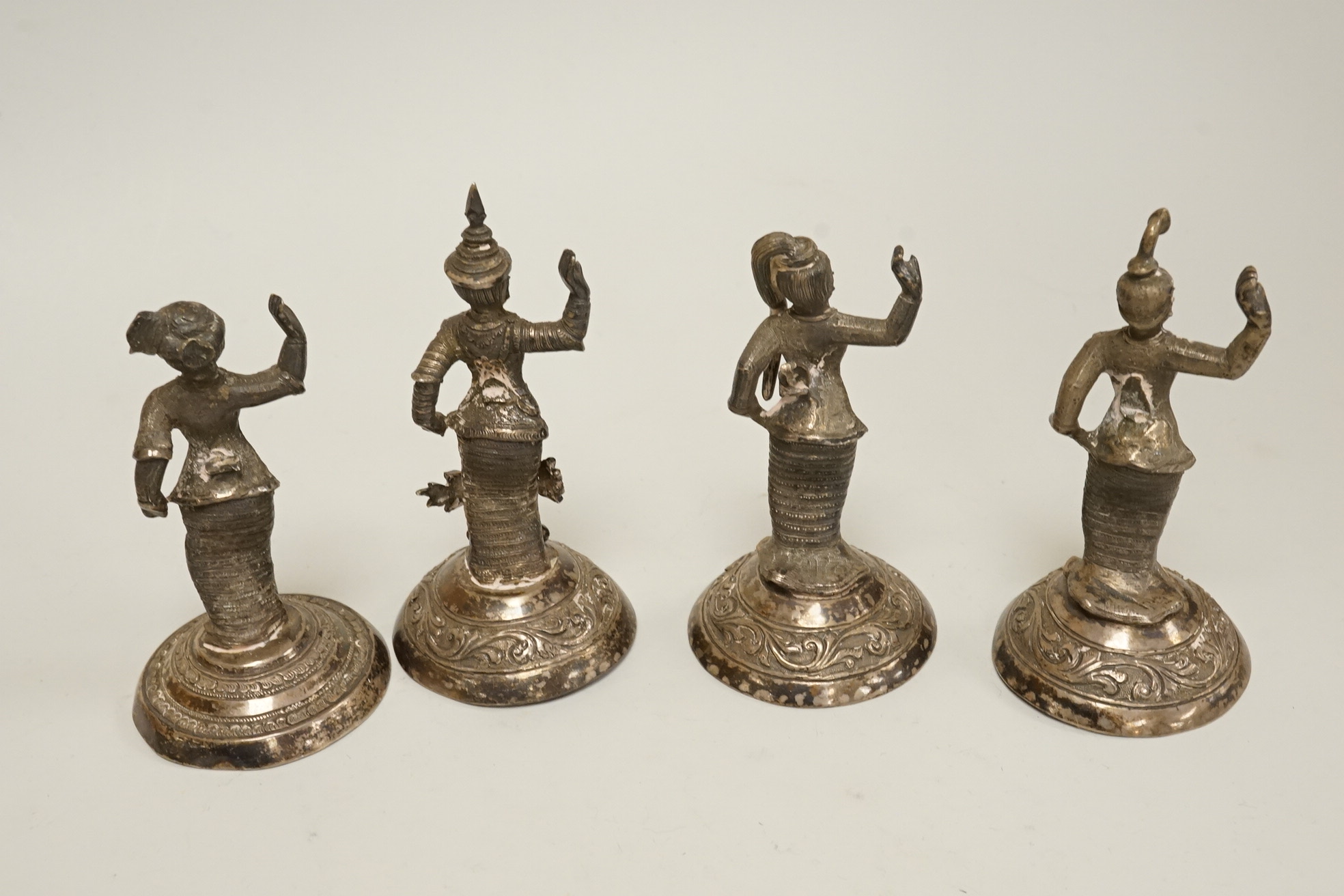 Four early 20th century Thai white metal figurines, 92mm et infra, 11.3oz.
